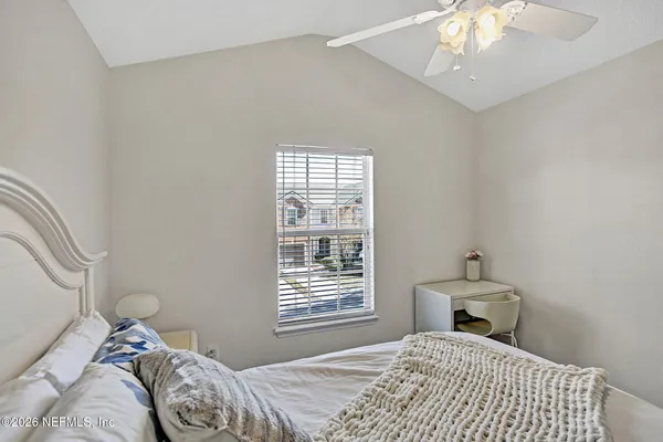 a bedroom with a bed and a view of bathroom