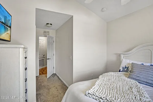 a bedroom with a bed and furniture