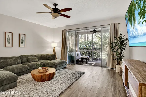 a living room with furniture and a large window