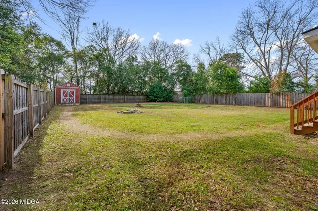 a view of a swimming pool with an outdoor space and seating area