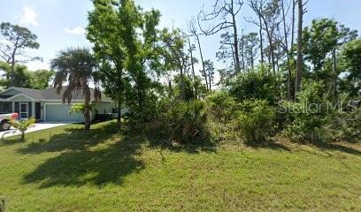 466 Sunset Road North Rotonda West, FL 33947 - Photo 1 of 1 a view of a backyard