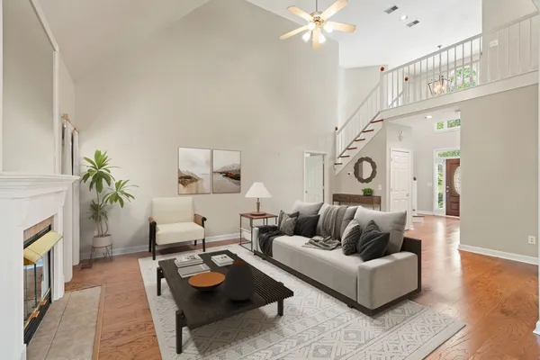 a living room with furniture and a fireplace