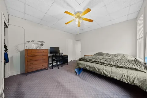 a view of an empty room with a fan