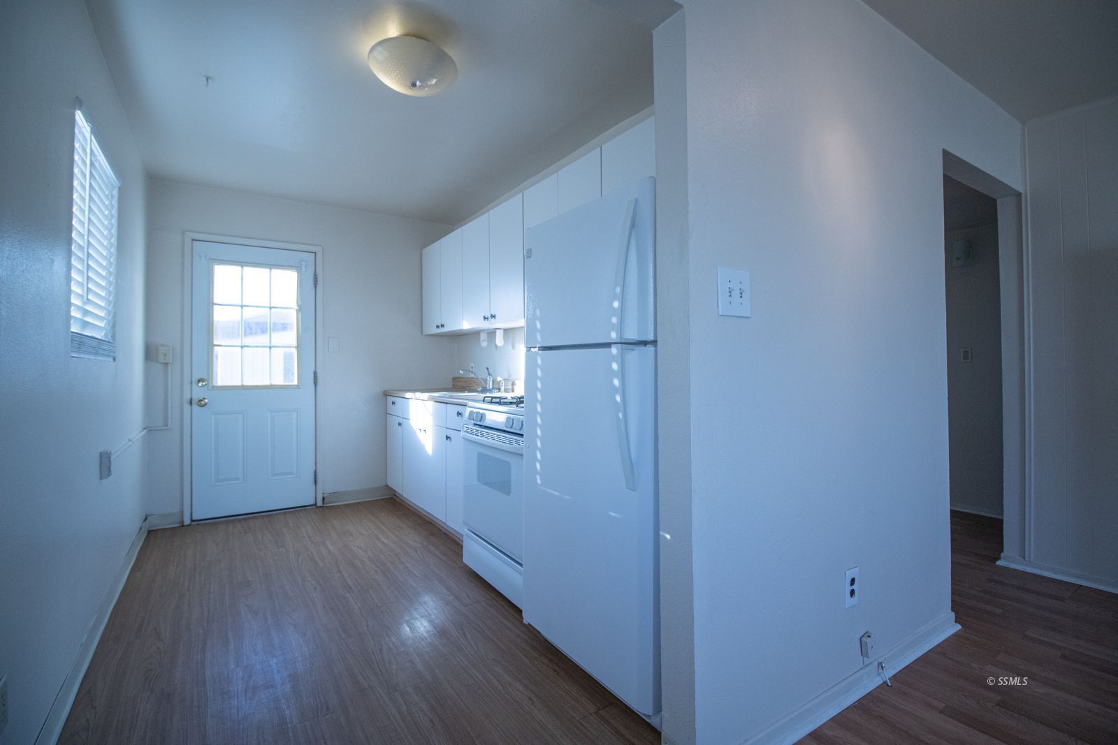 1621 Sims Street Ridgecrest, CA 93555 - Photo 6 of 24 a view of hallway with wooden floor