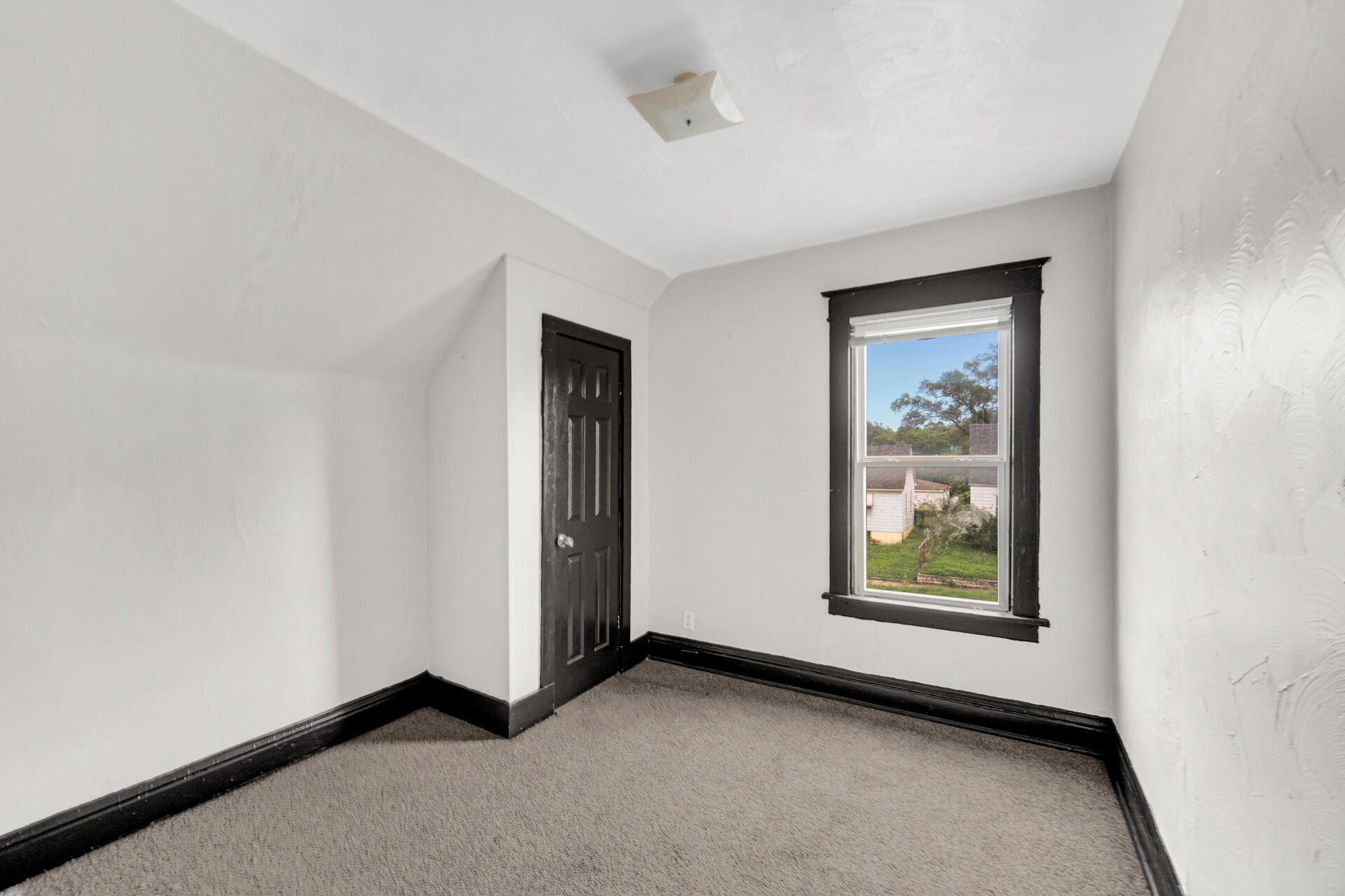 1356 Johnson Street Gary, IN 46407 - Photo 11 of 12 an empty room with windows and closet