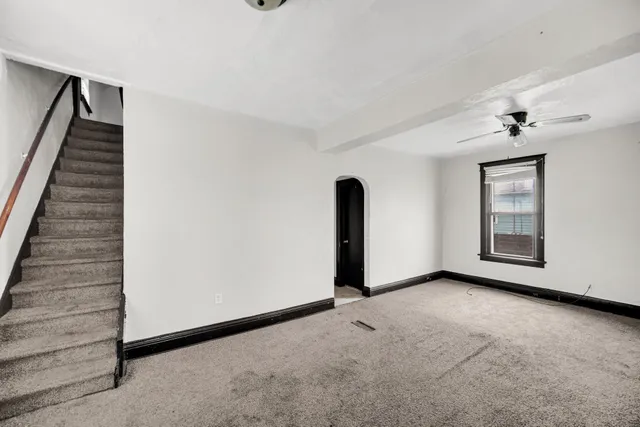 a view of an empty room with windows