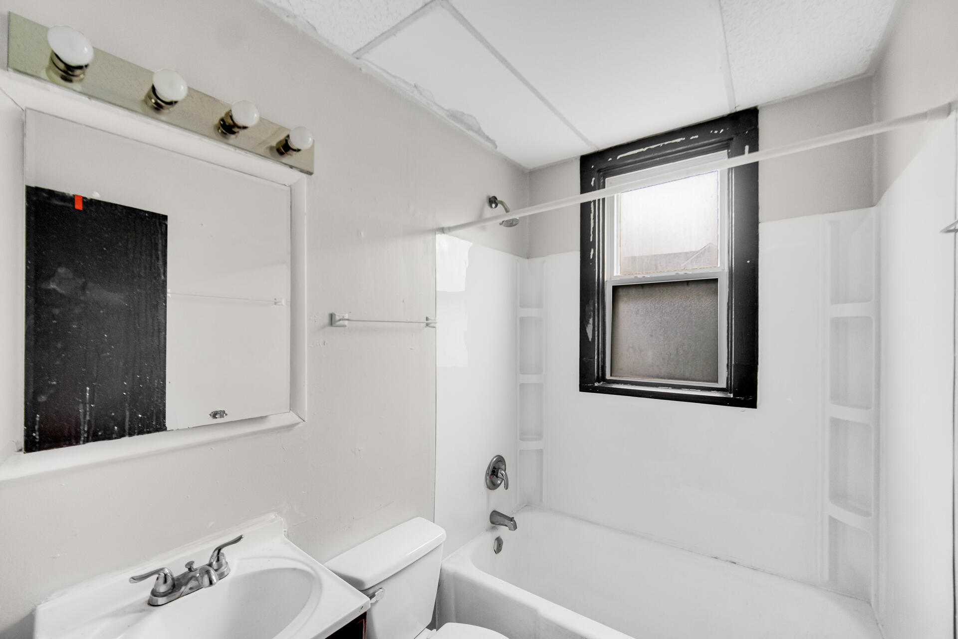 1356 Johnson Street Gary, IN 46407 - Photo 6 of 12 a bathroom with a bathtub and a sink