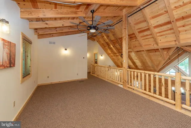 a view of a porch with wooden floor