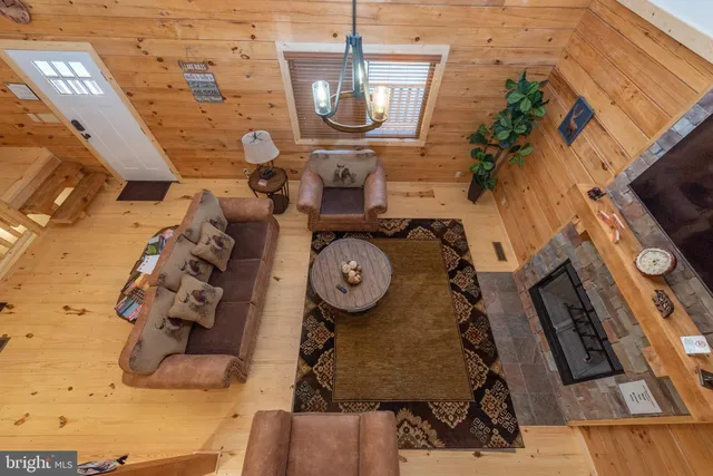 a view of living room with furniture and a clock