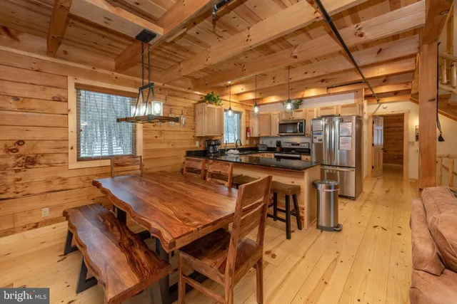 a view of a patio with table and chairs