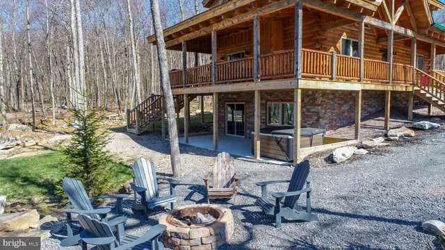 a view of a patio with table and chairs and potted plants