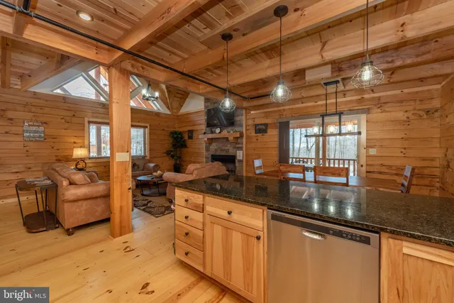 a kitchen with stainless steel appliances granite countertop a sink and cabinets