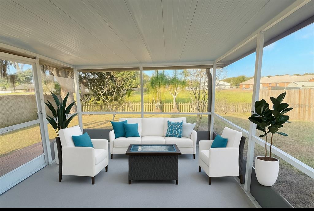 1921 Tinker Drive Lutz, FL 33559 - Photo 5 of 12 a living room with furniture and a large window