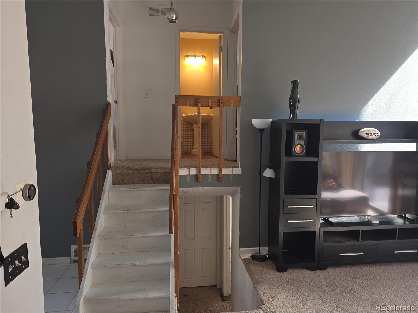 3771 South Danube Circle Aurora, CO 80013 - Photo 12 of 25 a kitchen with a refrigerator and a stove