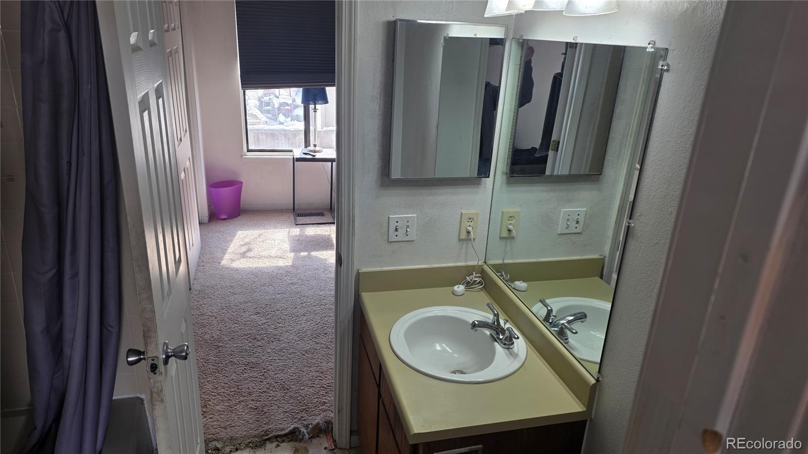 3771 South Danube Circle Aurora, CO 80013 - Photo 16 of 25 a bathroom with a sink a toilet and shower