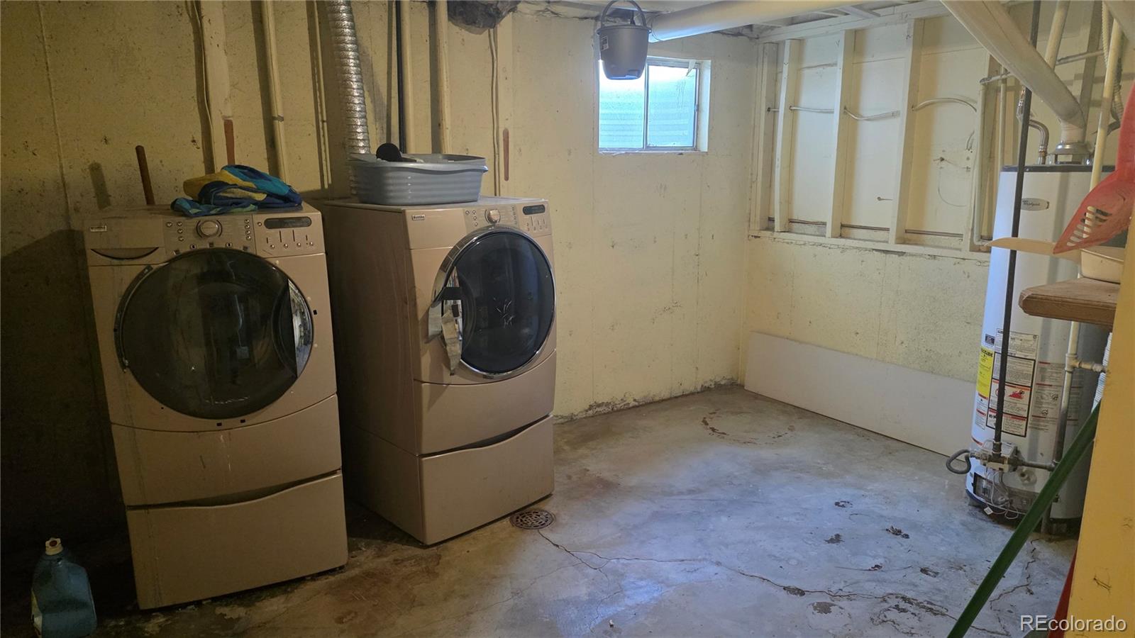 3771 South Danube Circle Aurora, CO 80013 - Photo 24 of 25 a view of a storage & utility room with a washer dryer