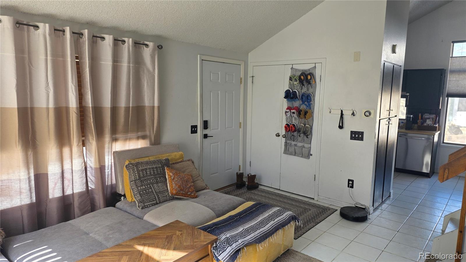 3771 South Danube Circle Aurora, CO 80013 - Photo 7 of 25 a bedroom with a bed and a couch