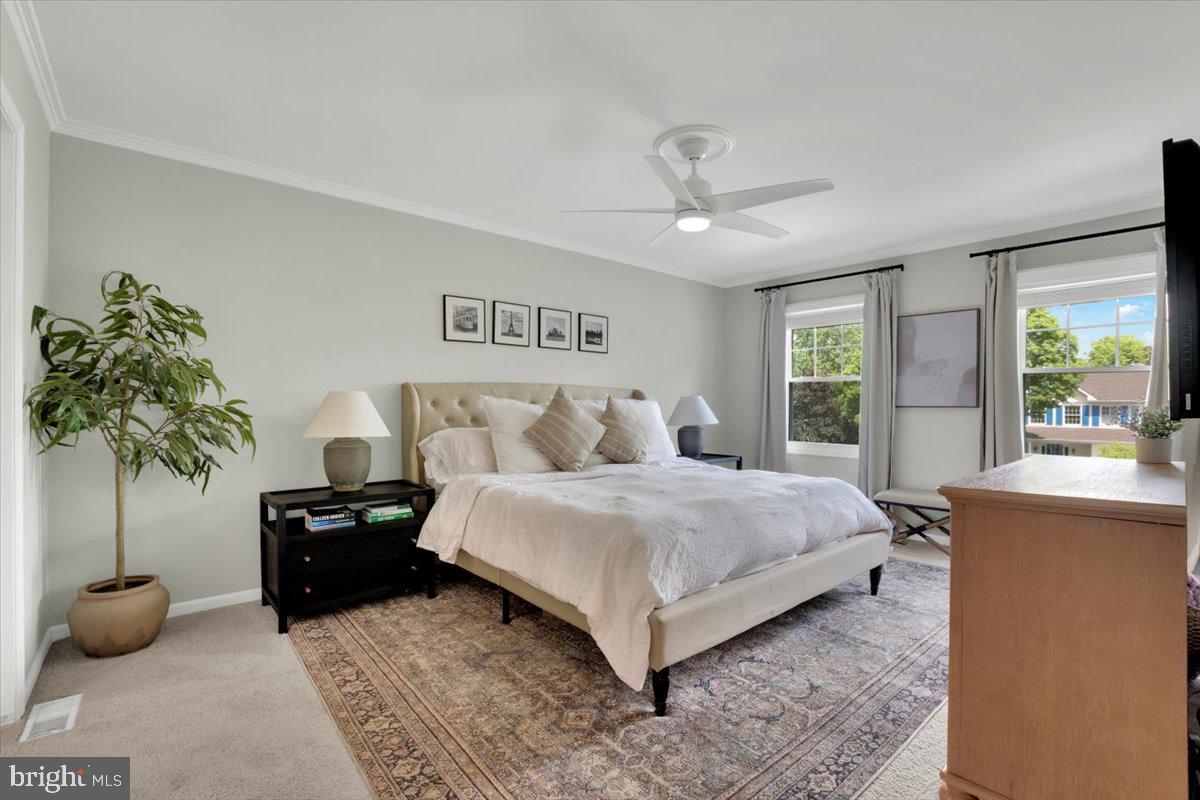 12649 Thunder Chase Drive Reston, VA 20191 - Photo 17 of 53 a bedroom with a bed and a couch