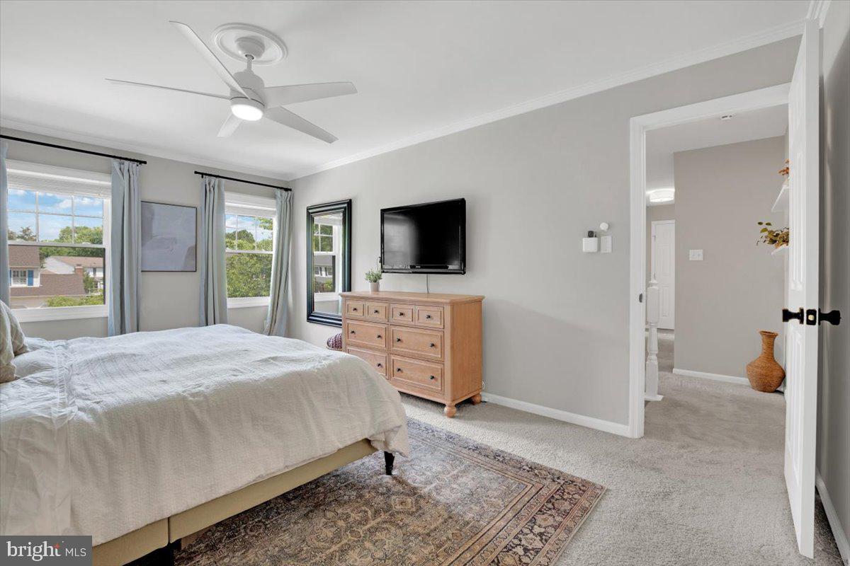 12649 Thunder Chase Drive Reston, VA 20191 - Photo 19 of 53 a bedroom with a bed and a flat screen tv