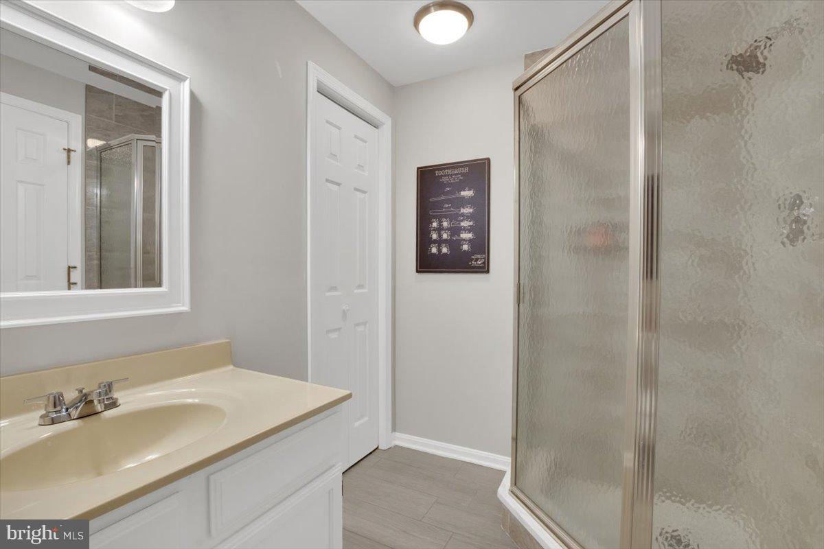 12649 Thunder Chase Drive Reston, VA 20191 - Photo 34 of 53 a bathroom with a sink and a mirror