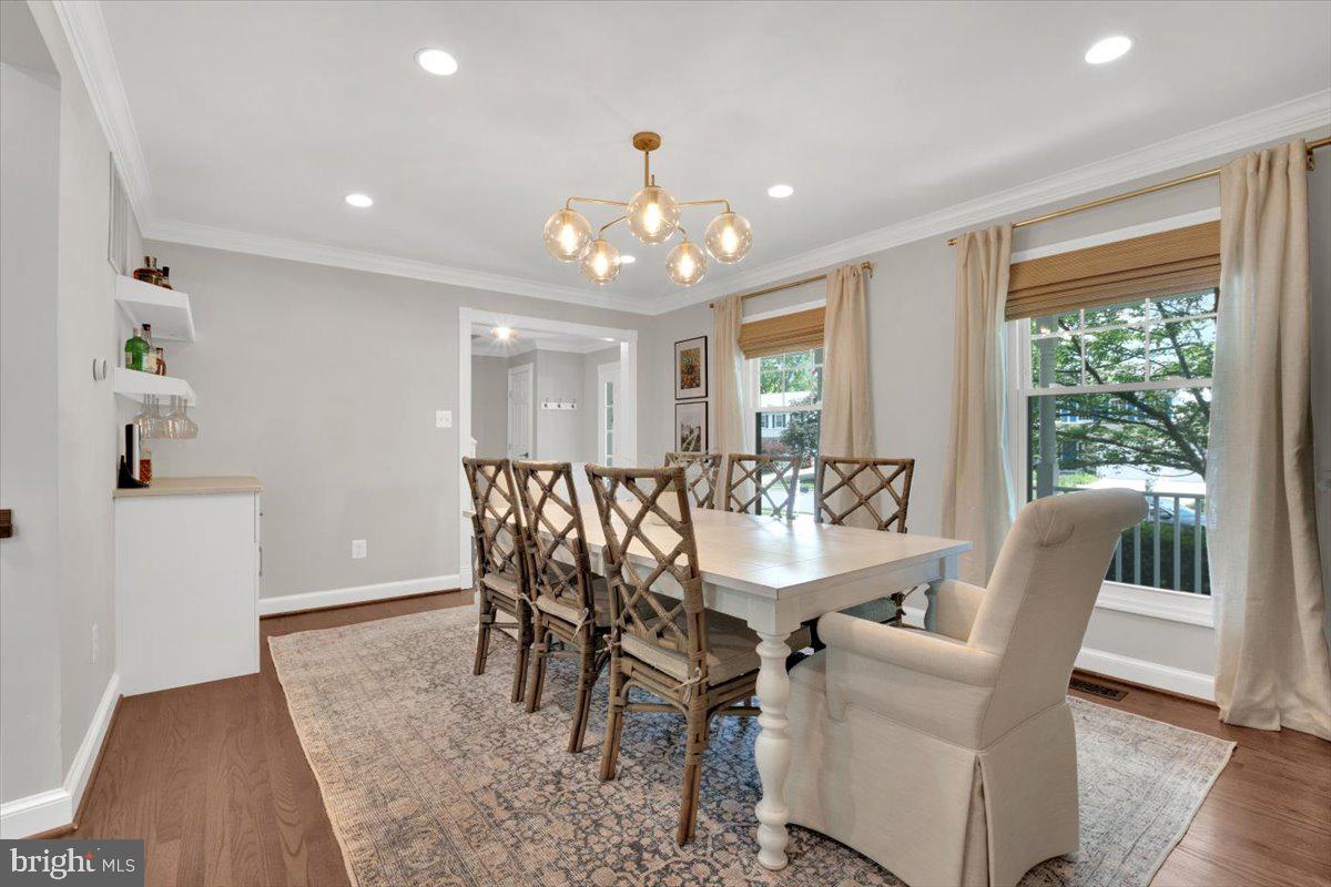 12649 Thunder Chase Drive Reston, VA 20191 - Photo 5 of 53 a view of a dining room with furniture window and wooden floor