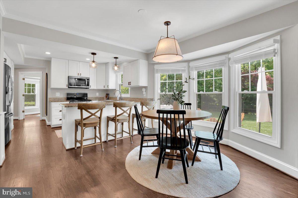 12649 Thunder Chase Drive Reston, VA 20191 - Photo 7 of 53 a view of a dining room with furniture window and wooden floor