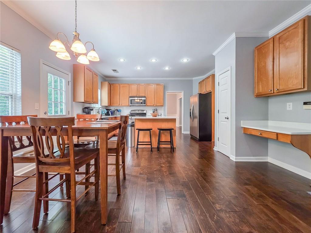 43 Ivy Mist Lane Acworth, GA 30101 - Photo 12 of 58 an open kitchen with a table and chairs in it
