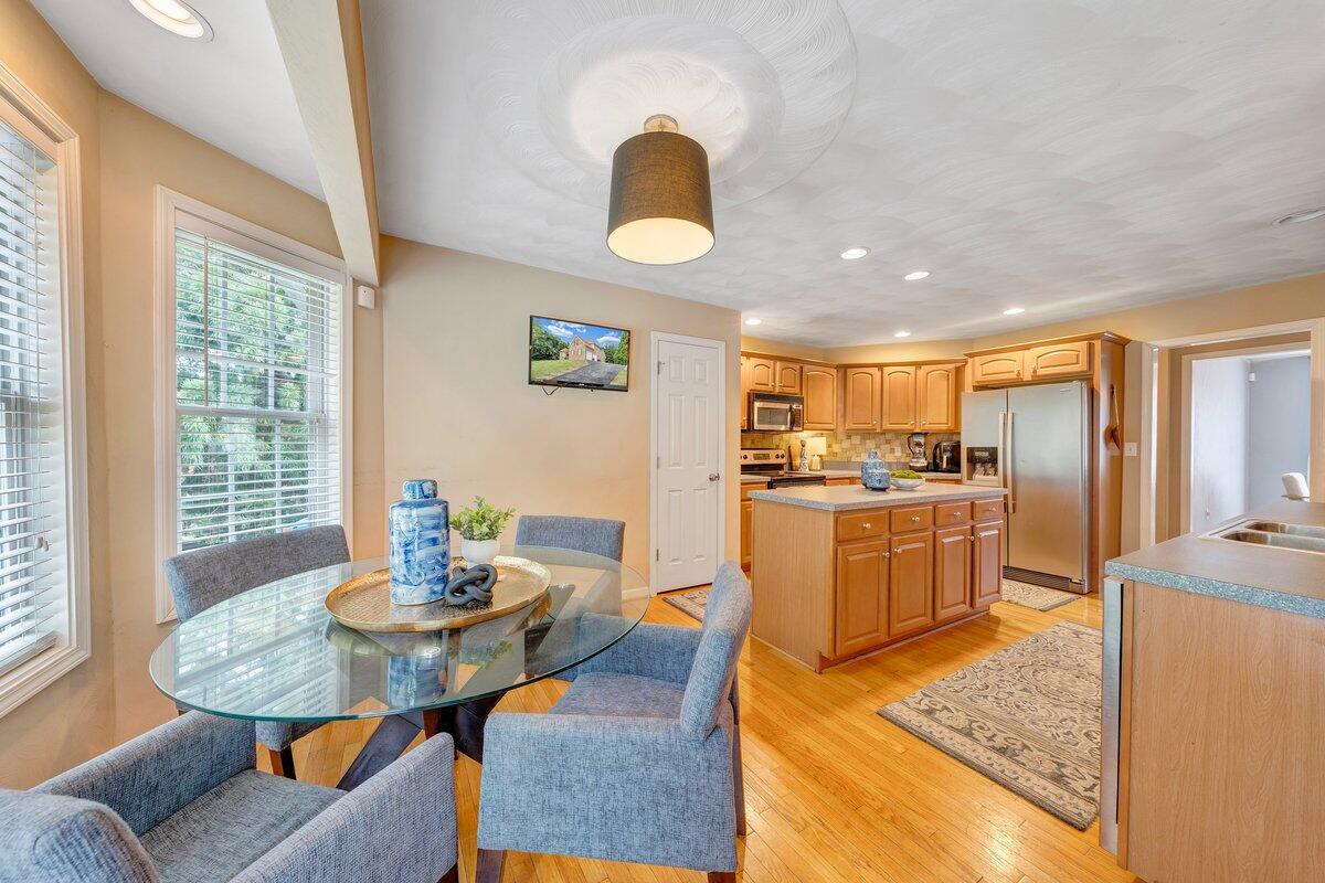 3770 Laurel Ridge Road Northwest Roanoke, VA 24019 - Photo 20 of 55 a kitchen with a table chairs sink and refrigerator