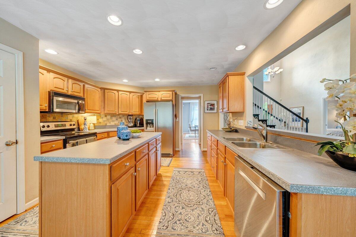 3770 Laurel Ridge Road Northwest Roanoke, VA 24019 - Photo 21 of 55 a kitchen with stainless steel appliances granite countertop a sink stove and refrigerator