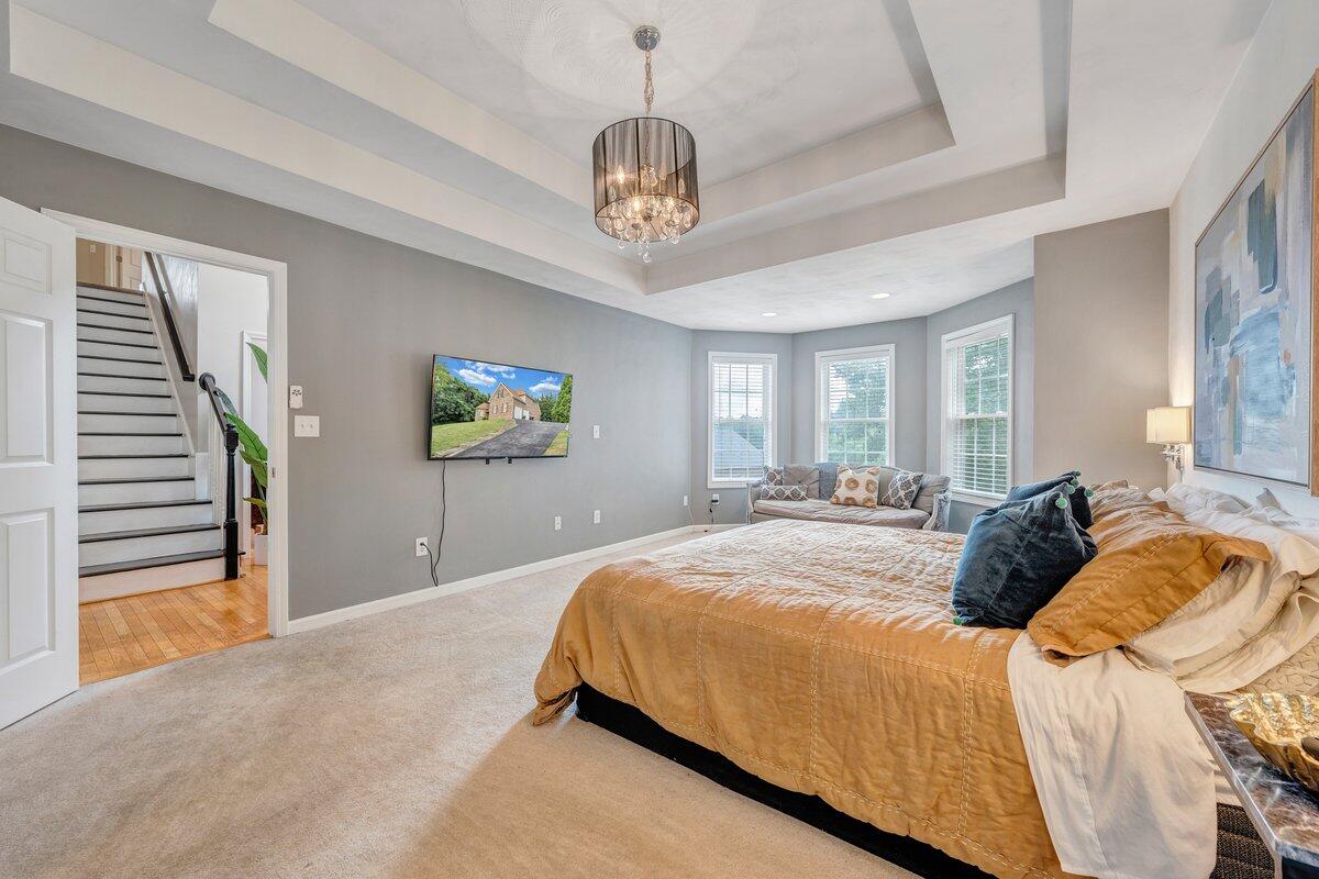 3770 Laurel Ridge Road Northwest Roanoke, VA 24019 - Photo 29 of 55 a bedroom with bed and a chandelier