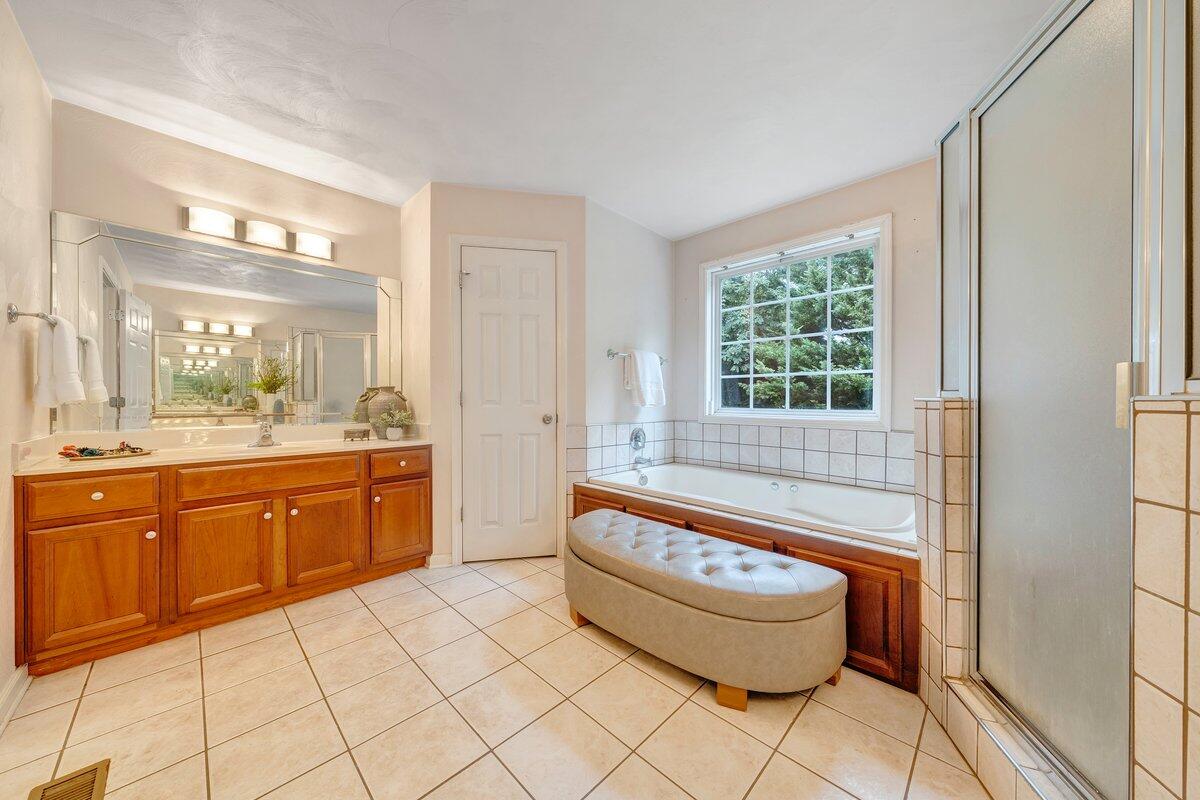 3770 Laurel Ridge Road Northwest Roanoke, VA 24019 - Photo 31 of 55 a spacious bathroom with a bathtub sink and toilet