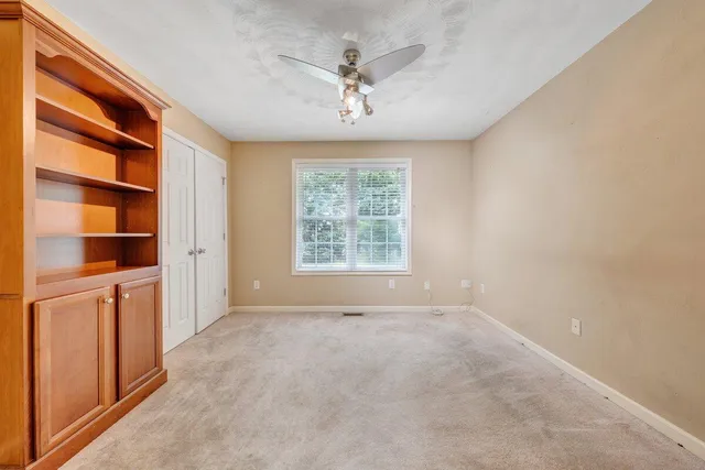 a spacious bathroom with a double vanity sink and a mirror