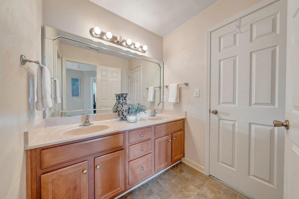 3770 Laurel Ridge Road Northwest Roanoke, VA 24019 - Photo 35 of 55 a spacious bathroom with a double vanity sink and a mirror