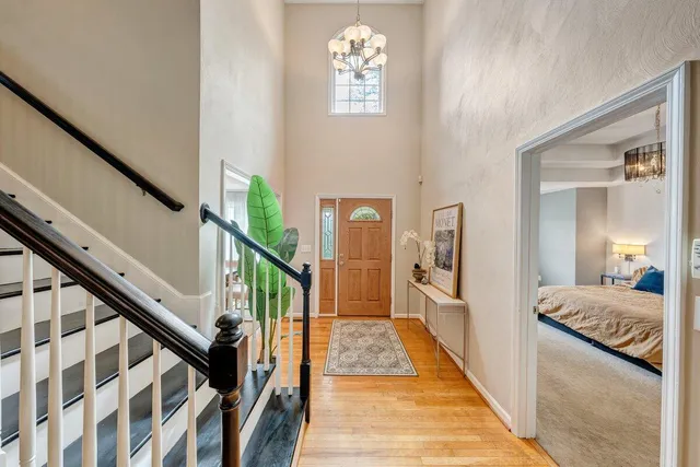 a view of a hallway with furniture and stairs