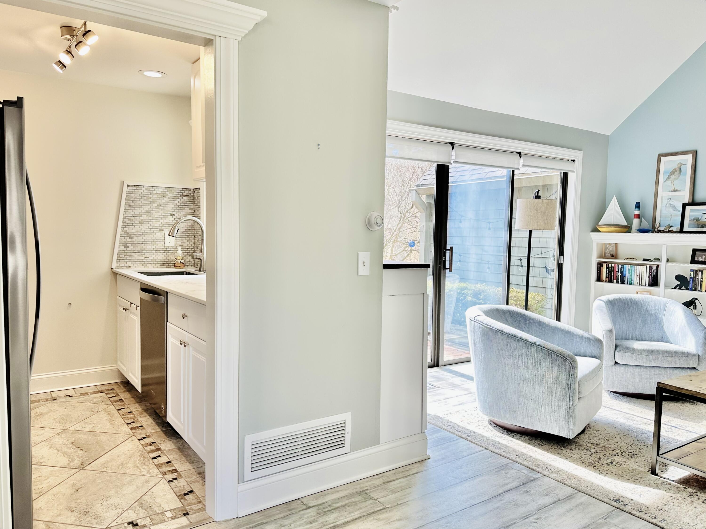 22 Mid-Iron Way, Unit 7517 Mashpee, MA 02649 - Photo 14 of 47 a living room with furniture and a walk in closet with wooden floor