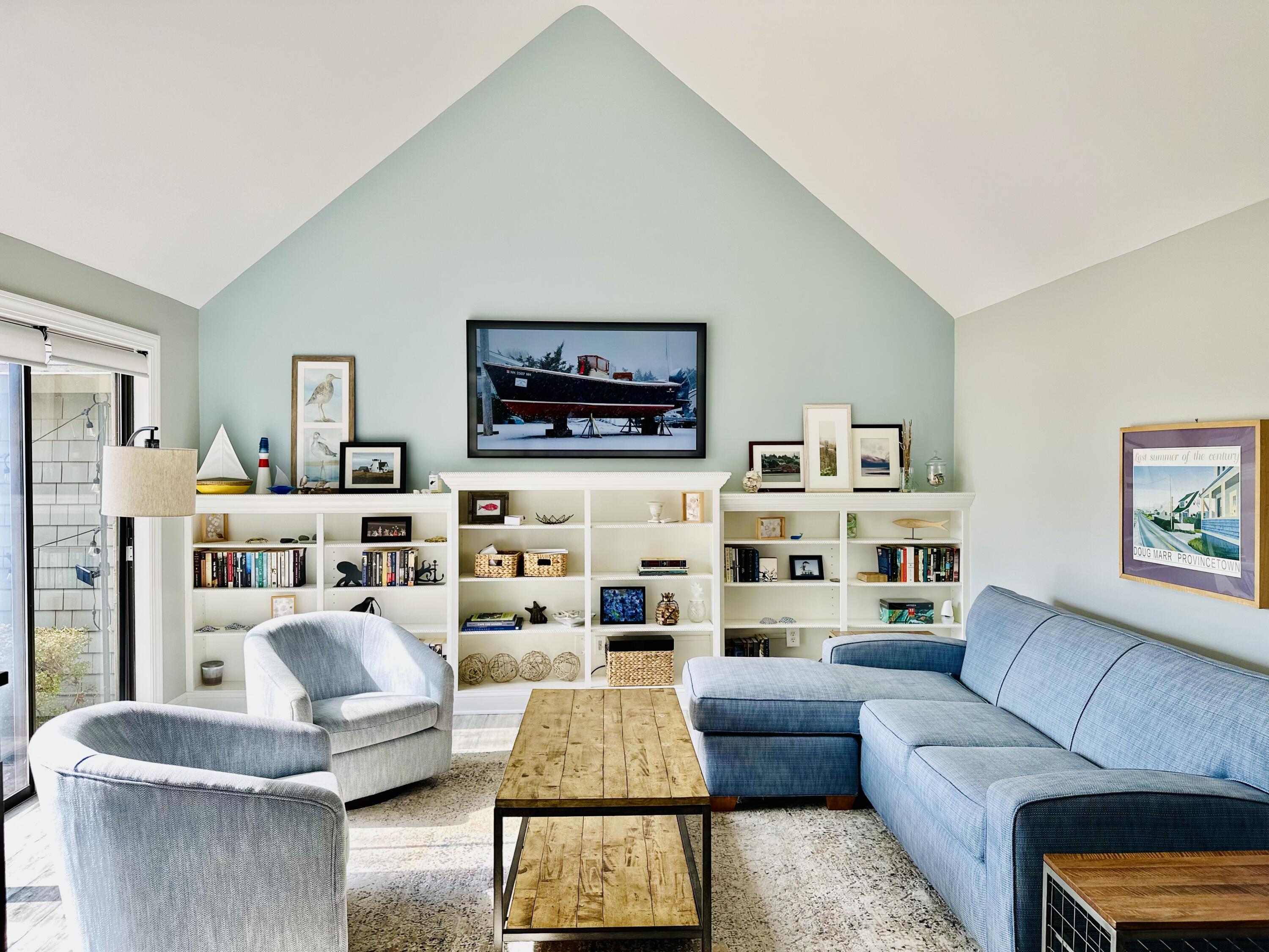 22 Mid-Iron Way, Unit 7517 Mashpee, MA 02649 - Photo 10 of 47 a living room with furniture and a flat screen tv