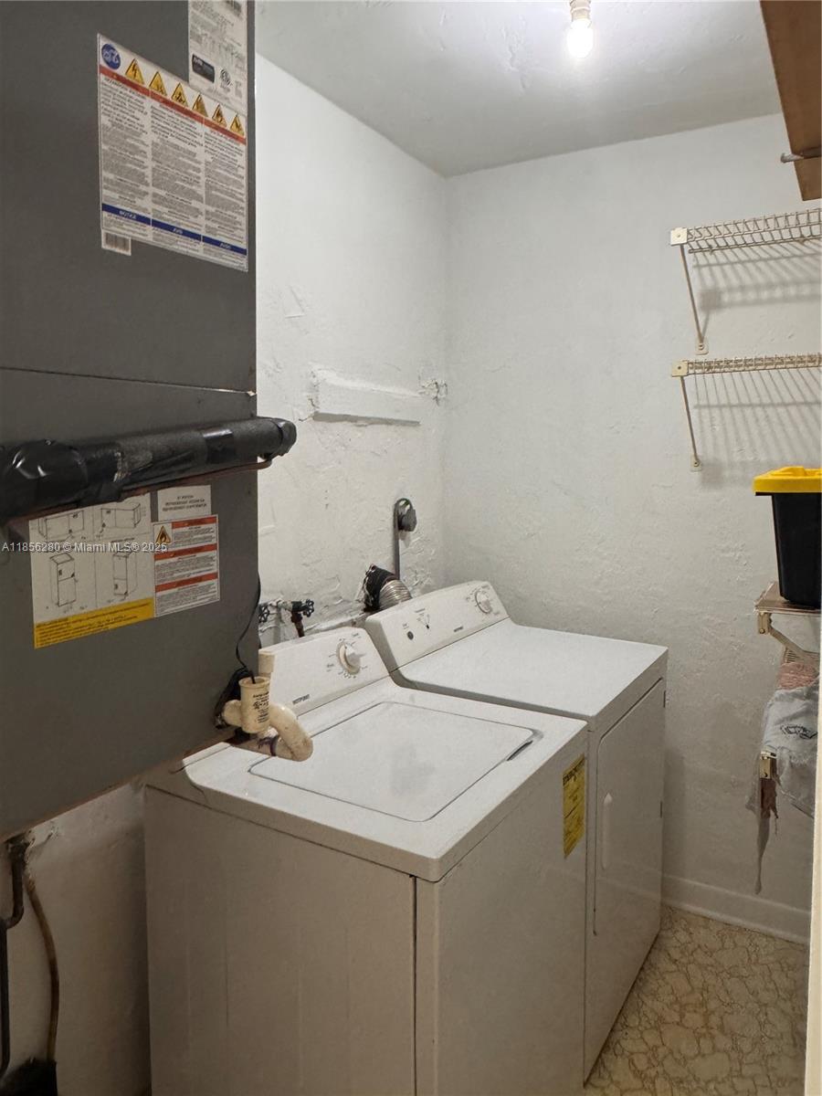 15888 Southwest 95th Avenue, Unit 201 Miami, FL 33157 - Photo 16 of 27 a utility room with dryer and washer