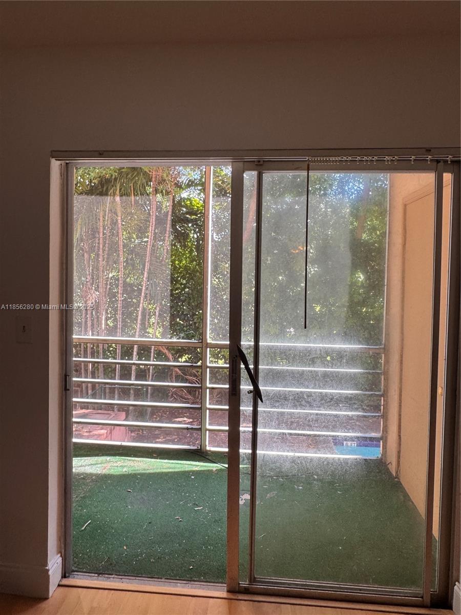 15888 Southwest 95th Avenue, Unit 201 Miami, FL 33157 - Photo 23 of 27 a view of swimming pool from a window