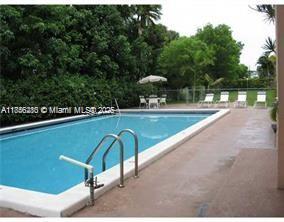 15888 Southwest 95th Avenue, Unit 201 Miami, FL 33157 - Photo 27 of 27 a view of a tennis court