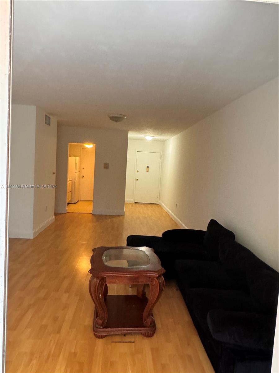 15888 Southwest 95th Avenue, Unit 201 Miami, FL 33157 - Photo 10 of 27 a living room with furniture