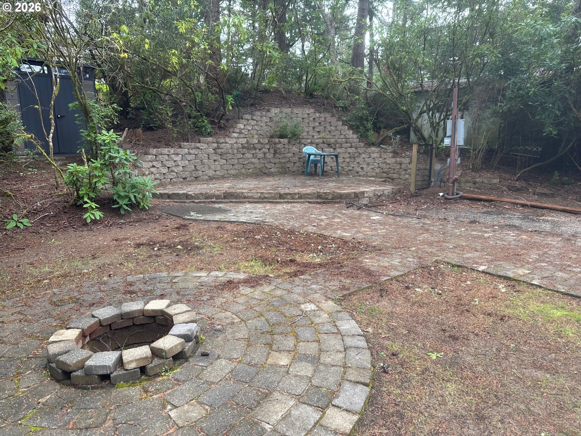 71 Castaway Cove Florence, OR 97439 - Photo 12 of 15 a backyard of a house with lots of green space and fountain view