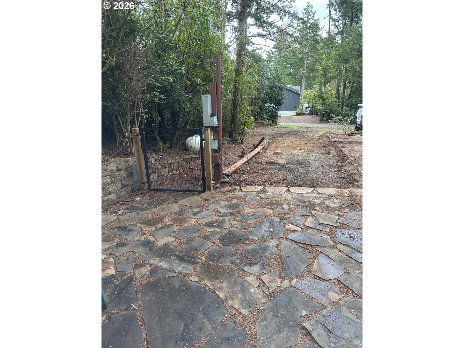 71 Castaway Cove Florence, OR 97439 - Photo 10 of 15 a view of a backyard with a trees