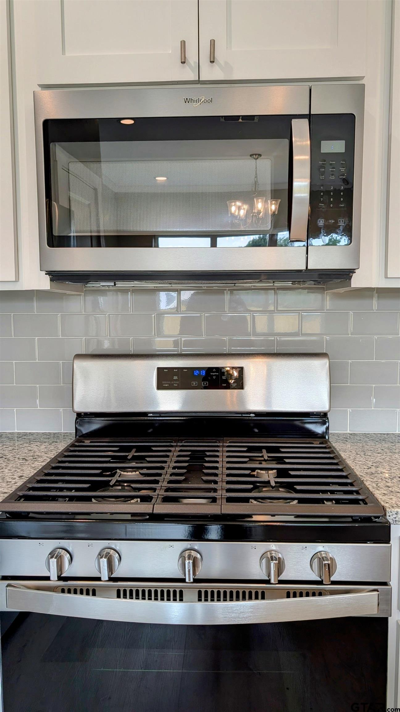 1302 Berkli Cove Whitehouse, TX 75791 - Photo 6 of 20 a stove top oven sitting inside of a kitchen