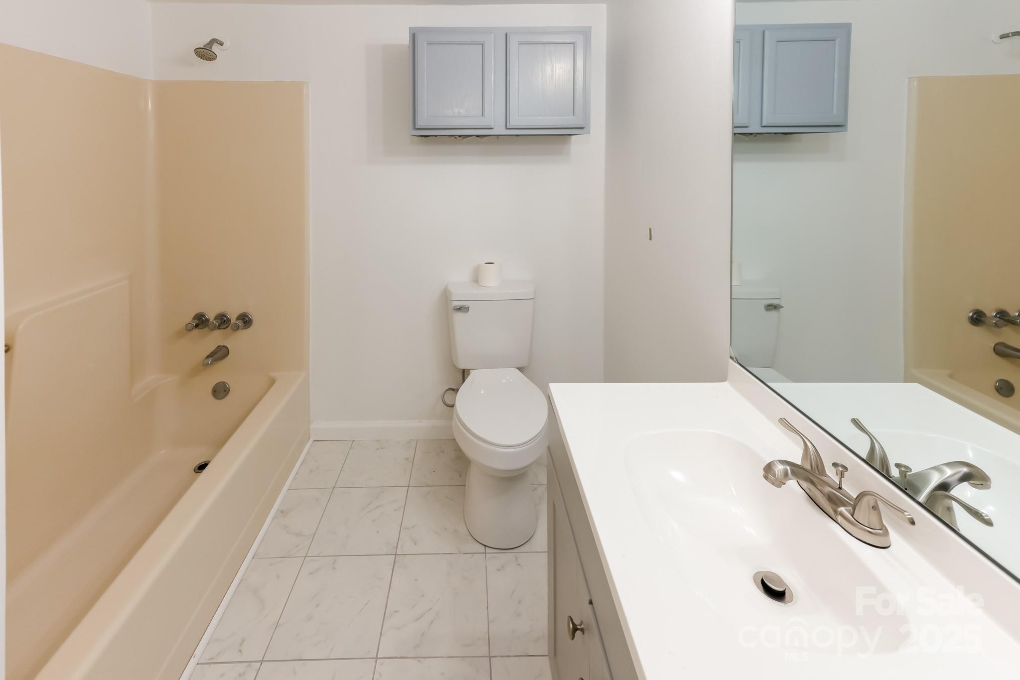 344 Piedmont Road Rutherfordton, NC 28139 - Photo 14 of 25 a bathroom with a sink a toilet and shower