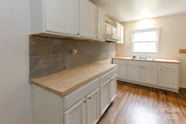 a kitchen with a sink and cabinets