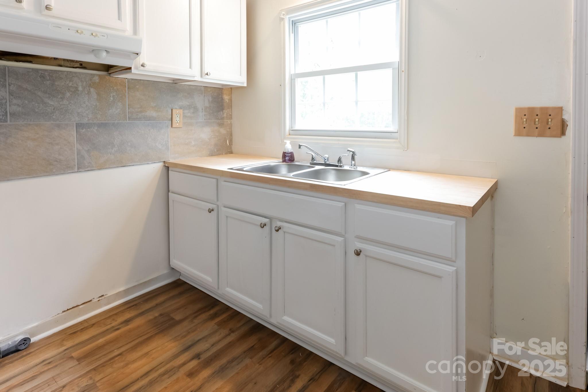 344 Piedmont Road Rutherfordton, NC 28139 - Photo 7 of 25 a bathroom with a sink and a window