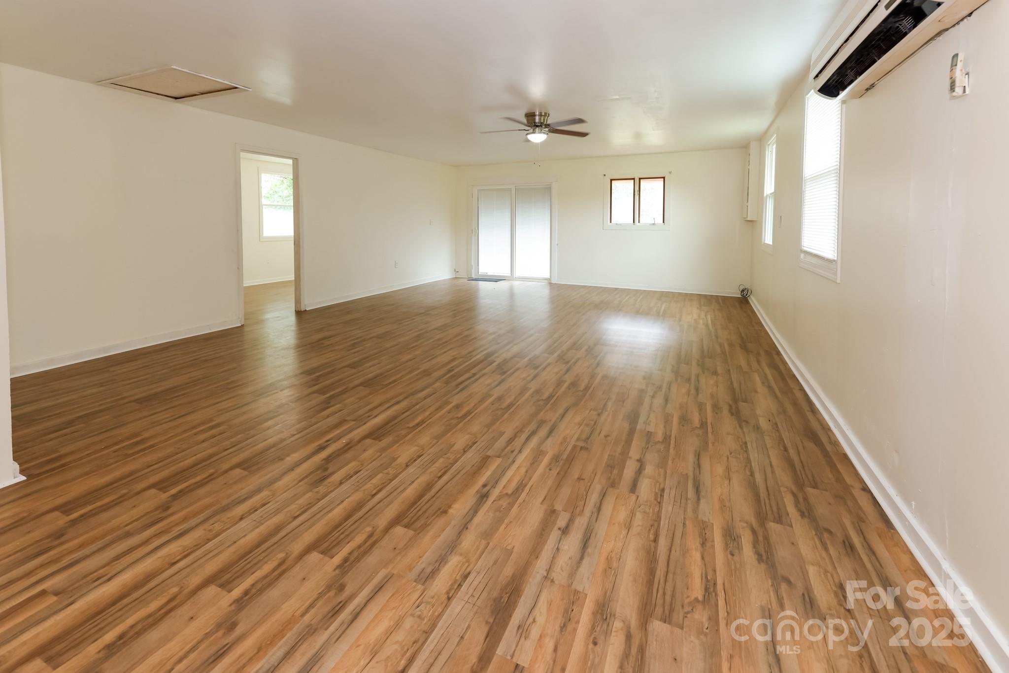 344 Piedmont Road Rutherfordton, NC 28139 - Photo 8 of 25 wooden floor in an empty room with a window