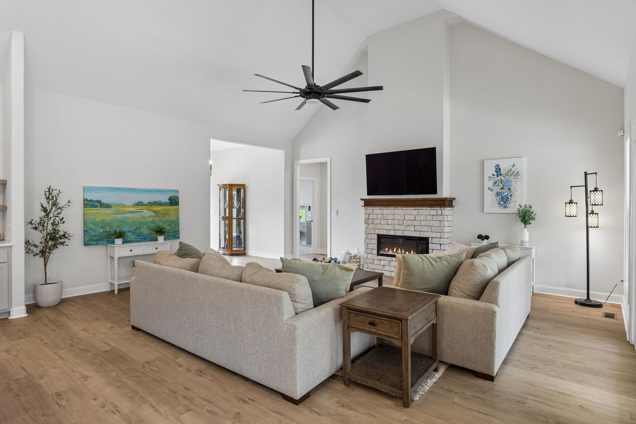 8708 Newtown Road Rockvale, TN 37153 - Photo 11 of 50 a living room with furniture a fireplace and a flat screen tv