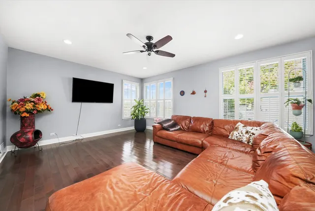 a living room with furniture fireplace and flat screen tv