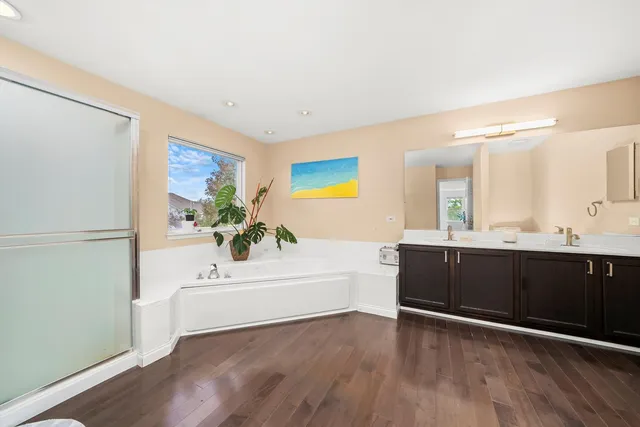 a bathroom with a bathtub and a sink